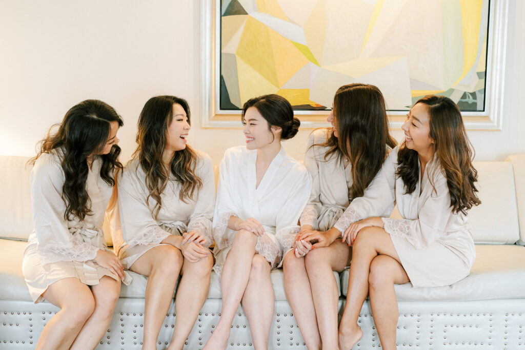 Bride and bridesmaids in matching robes at Lotte New York Palace