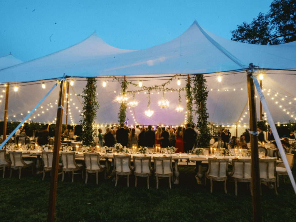 sailcloth tented wedding at night with guests dancing 