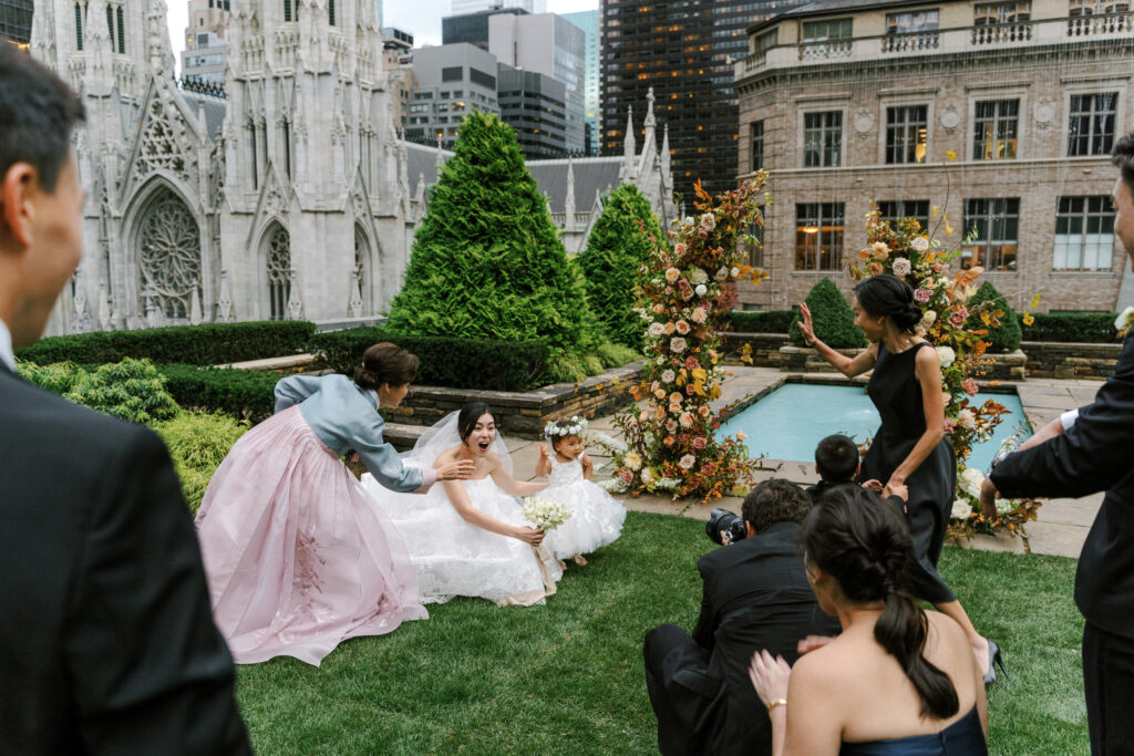 Bride and flower girls taking a photo at New York City wedding 