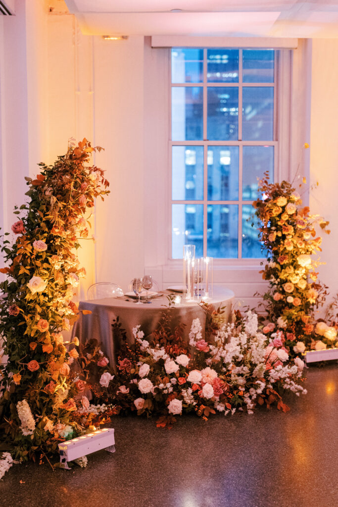 Sweetheart table surrounded by lush autumn fall florals by Winsome Floral 