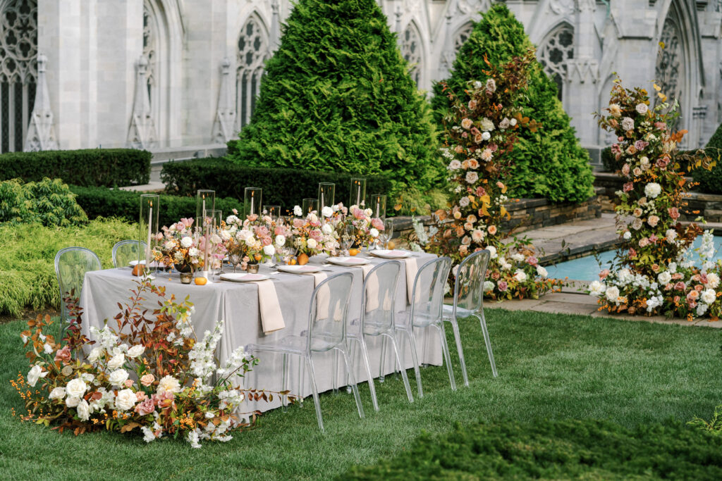 Wedding table with fall flowers and silver velvet linens designed by NYC wedding designer East Made Co 
