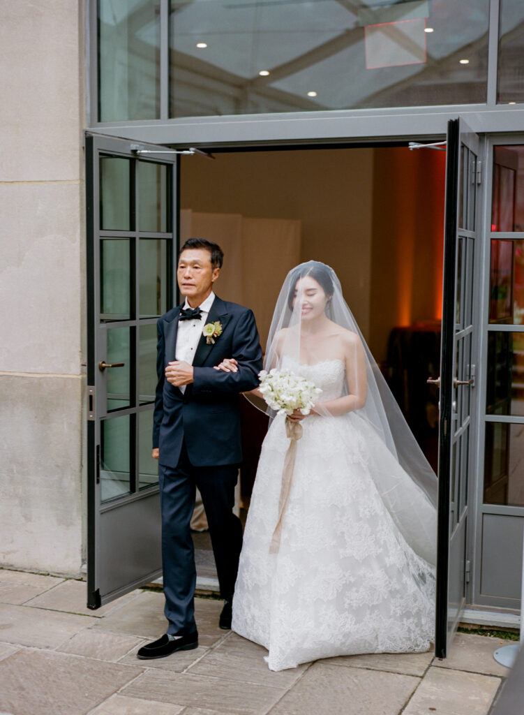 Bride and father entrance into ceremony at 620 Loft & Garden 
