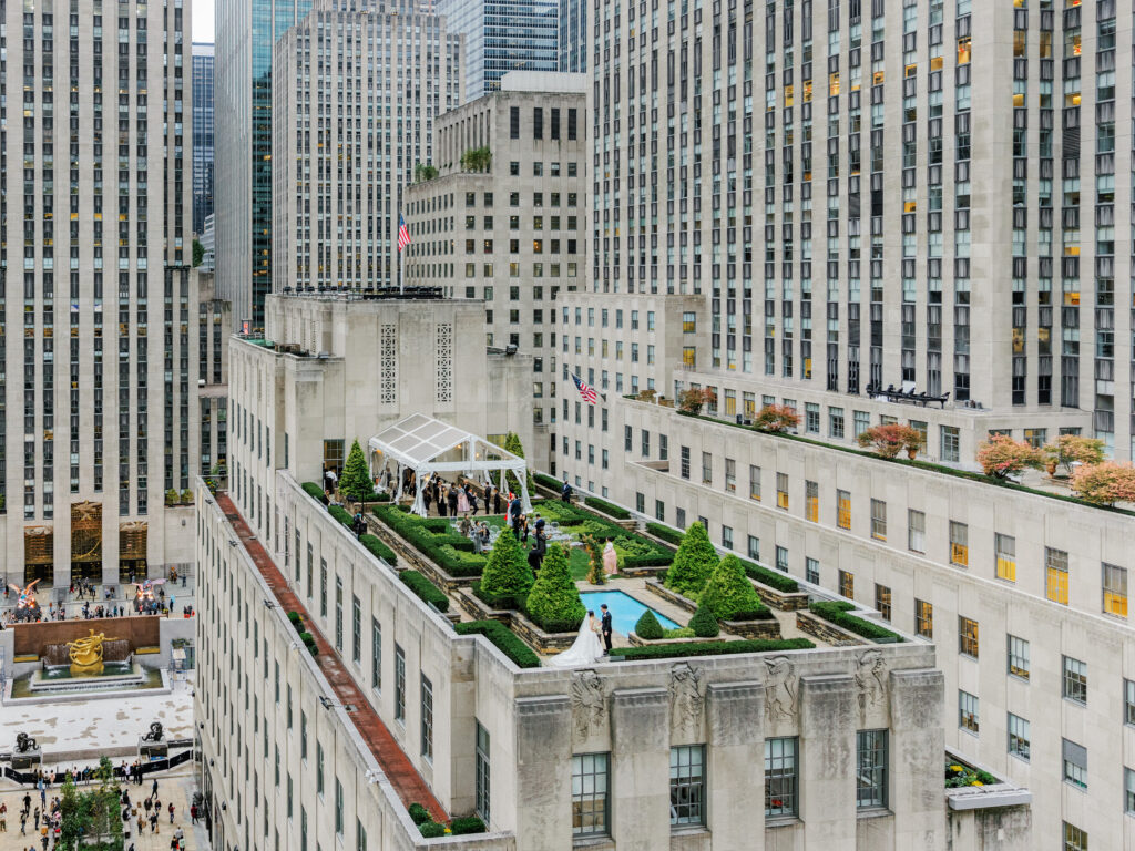 View of 620 Loft & Garden rooftop wedding venue in New York City with bride and groom 