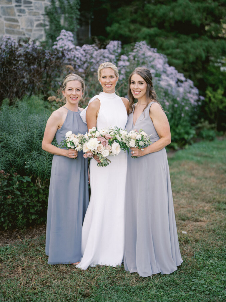 bride and bridesmaids in blue long dresses 