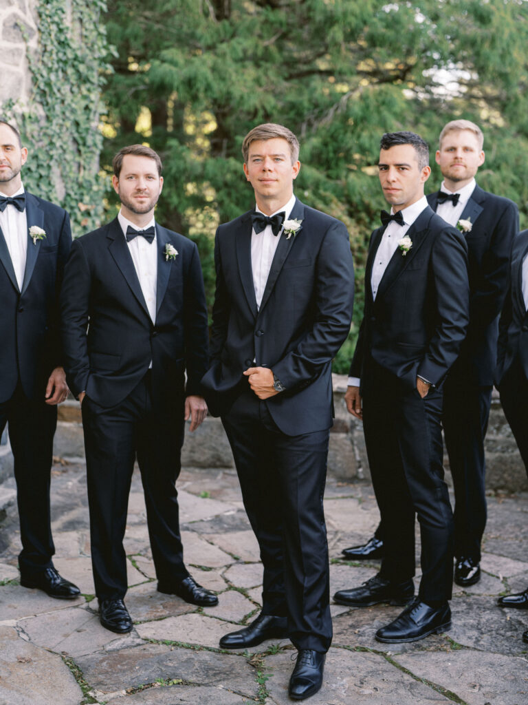 groom and groomsmen in tuxes 
