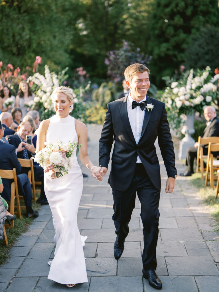 bride and groom recessional at luxury baltimore wedding outdoor garden 