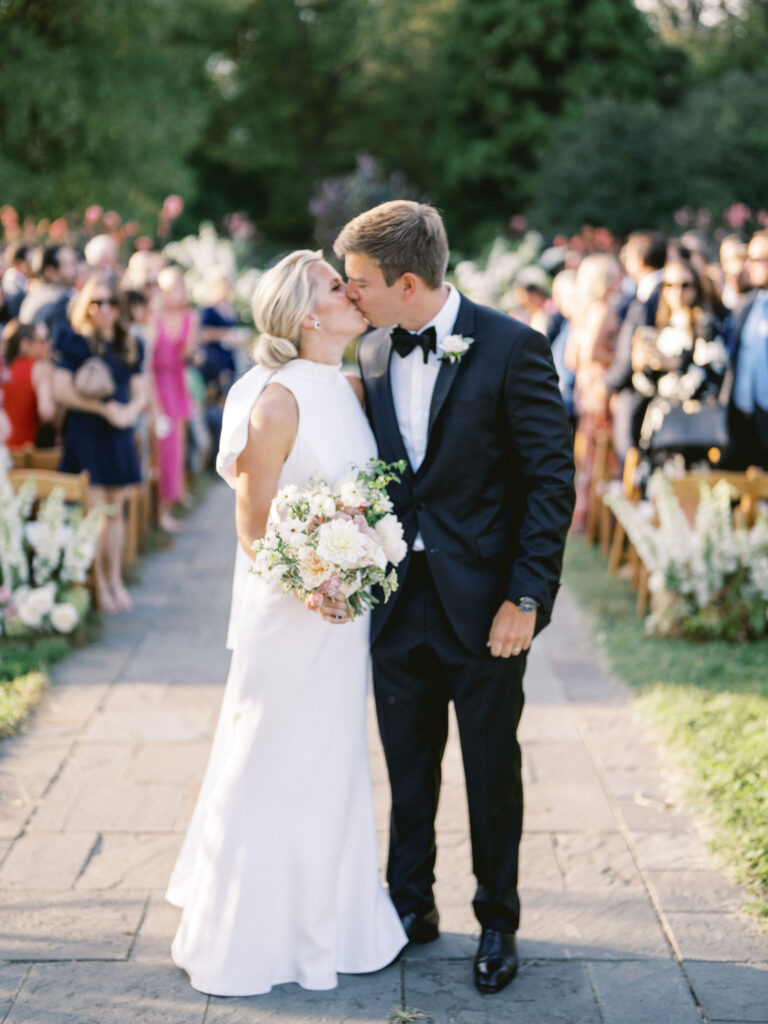 bride and groom kissing after ceremony at outdoor baltimore wedding 