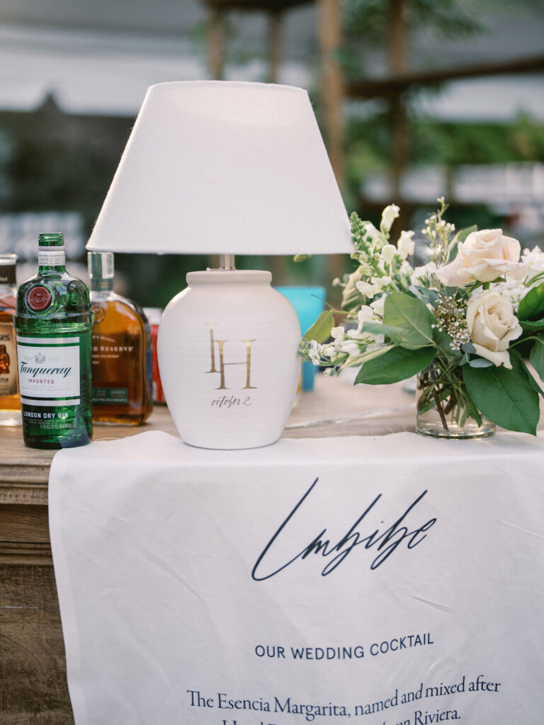 wedding bar lamp with monogram and imbibe bar sign on linen fabric 
