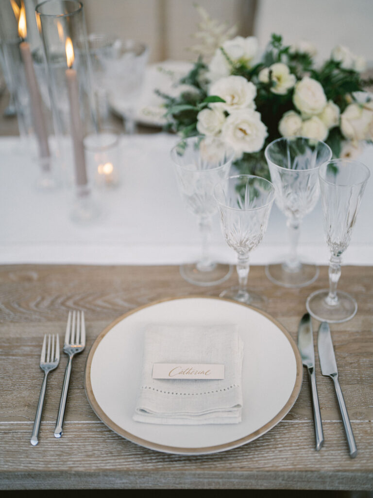 neutral linen and gold place setting with cut crystal glassware at baltimore wedding 
