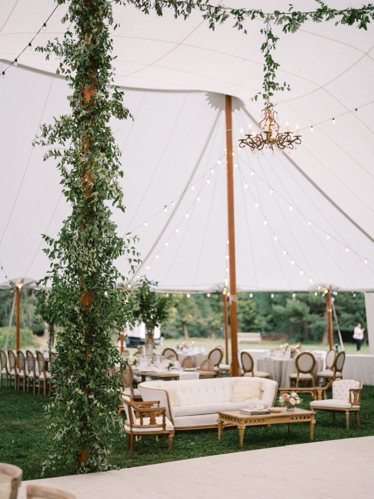 sailcloth tent wedding greenery and neutral lounge furniture 