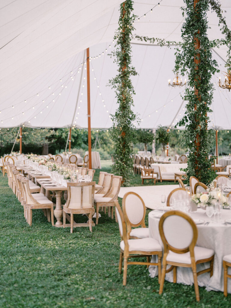 upholstered white chairs at baltimore outdoor tented wedding designed by east made co 