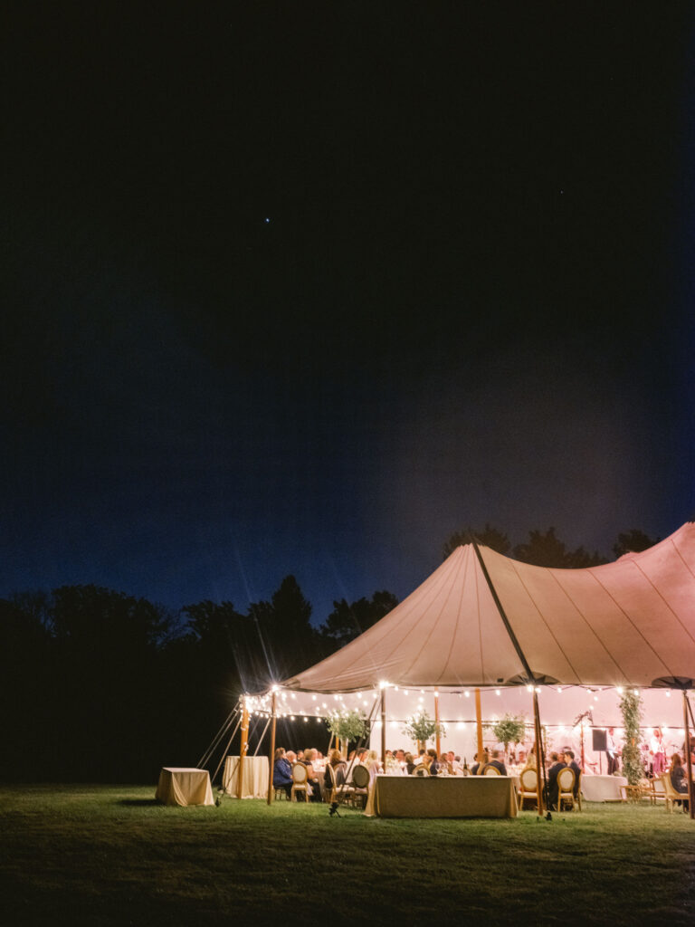 nighttime photo at wedding reception tented wedding 