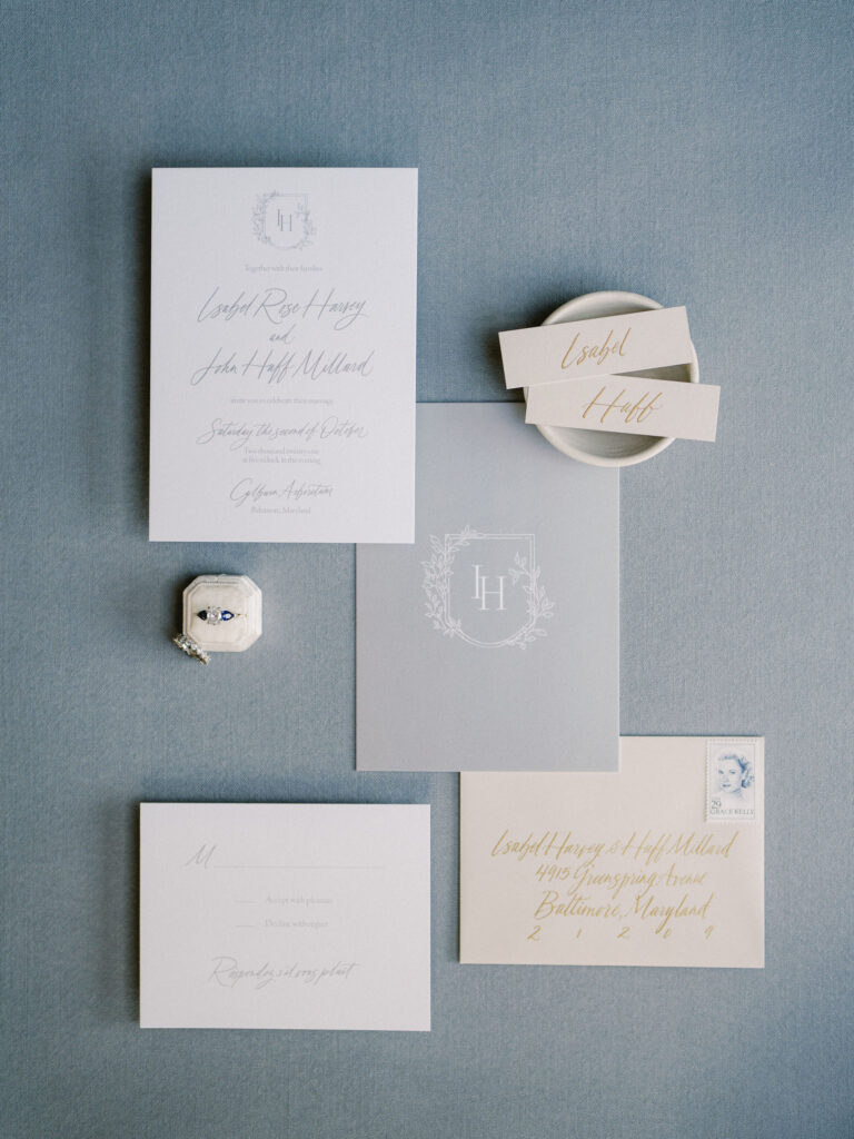 neutral blue grey wedding invitation with calligraphy 