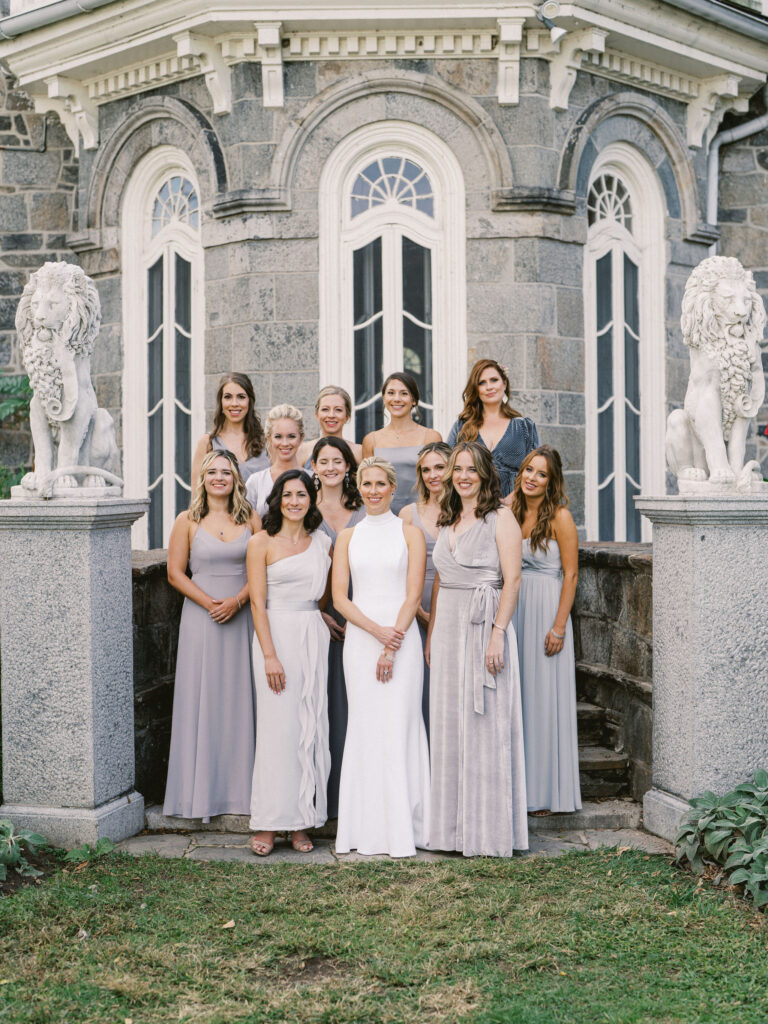 bridesmaids in mismatched long blue dresses on steps of cylburn mansion baltimore 