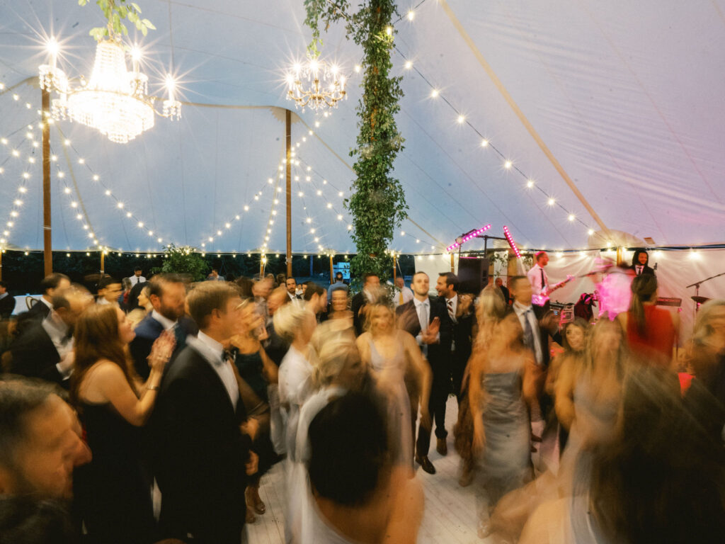 guests blur dancing at wedding reception 
