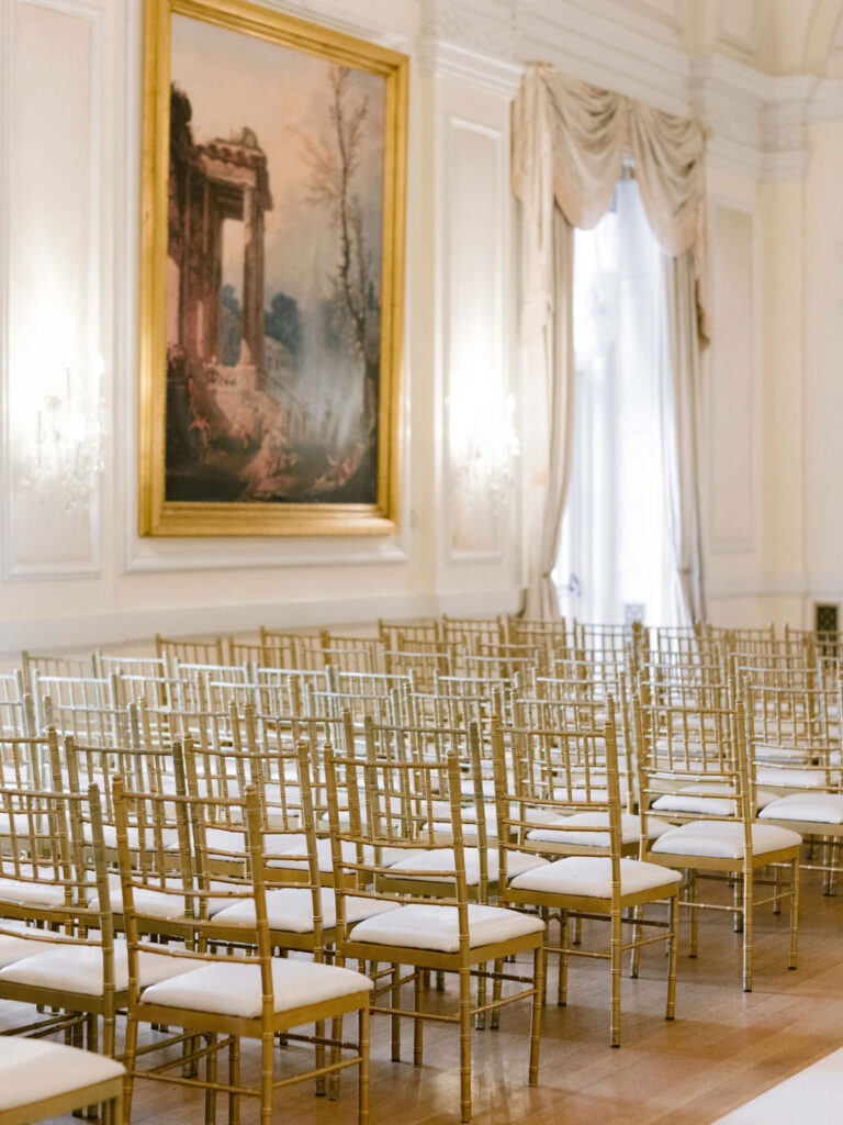gold chivari chairs inside ballroom at oheka castle 