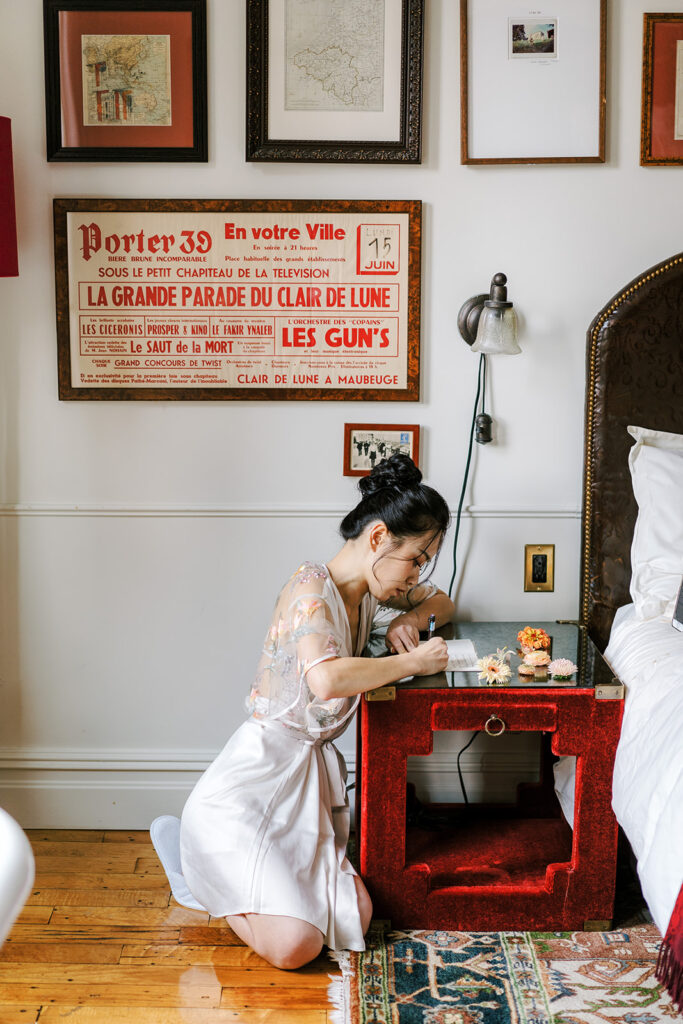 chinese bride writing her wedding vows in hotel room in new york city 