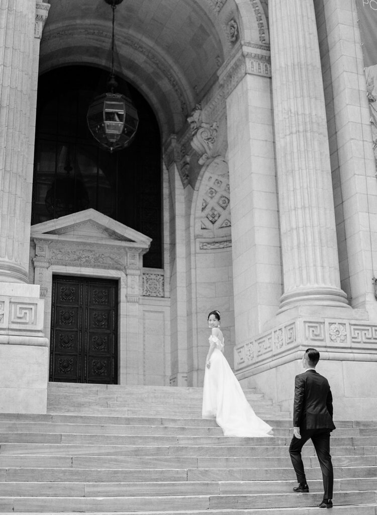 bride and groom at new york public library in black and white 
