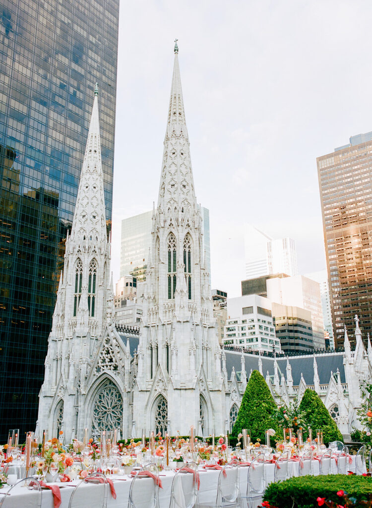wedding dinner outdoors on rooftop overlooking st. patrick's cathedral in new york city 
