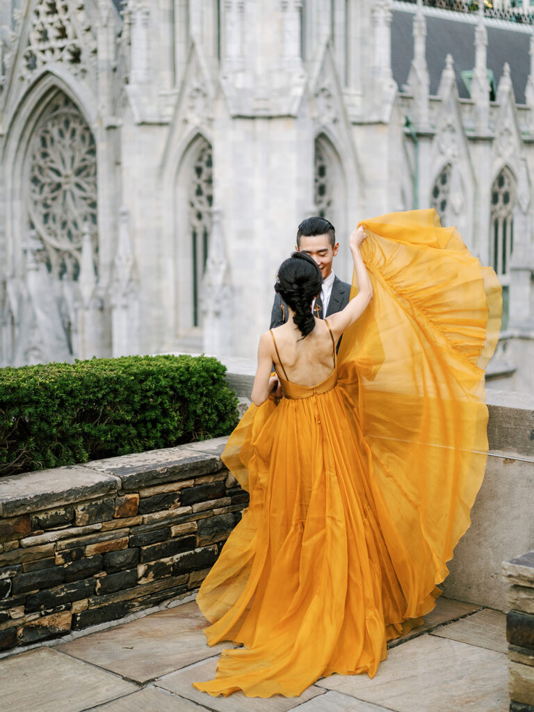 bride in mustard yellow leanne marshall wedding dress on rooftop 