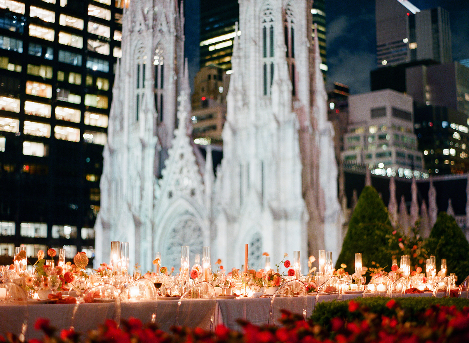st. patrick's cathedral in new york city with wedding reception tables by candlelight after summer wedding